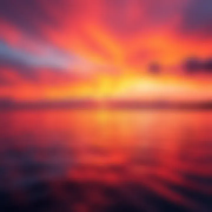 A vibrant sunset with orange and pink hues reflecting on calm water