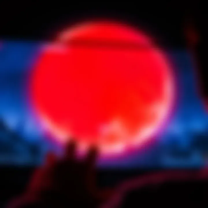 A gamer looks at a screen displaying a blood moon effect in a game, showcasing the visual challenges of red-green colorblindness.