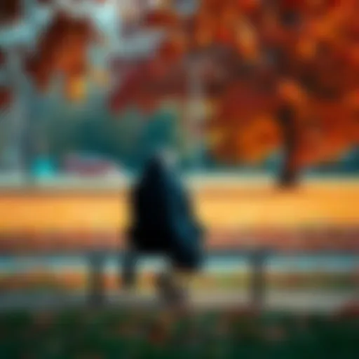 A person sitting alone on a bench, looking pensive and deep in thought, surrounded by autumn leaves