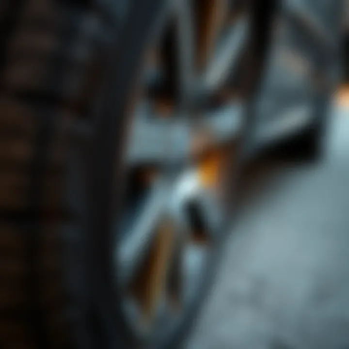 Close-up of old tires on a 2002 BMW with good tread.